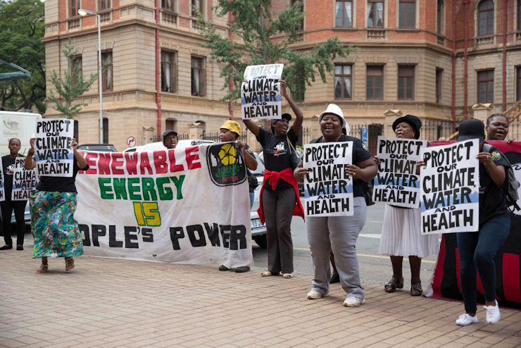 Environmental activists demonstrate outside the court during the hearing of the first Thabametsi coal-fired power station court case in March 2017
